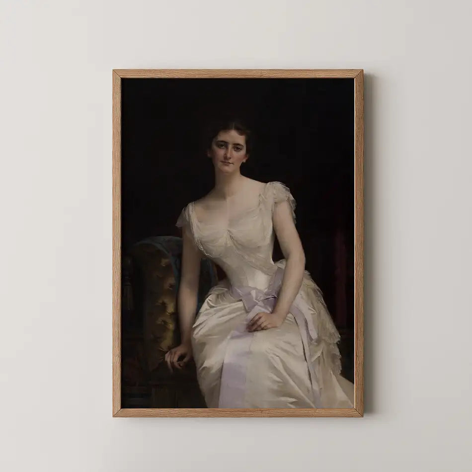 Portrait of a seated woman in a vintage gown with a light-colored dress and soft facial features, framed in a wooden frame.