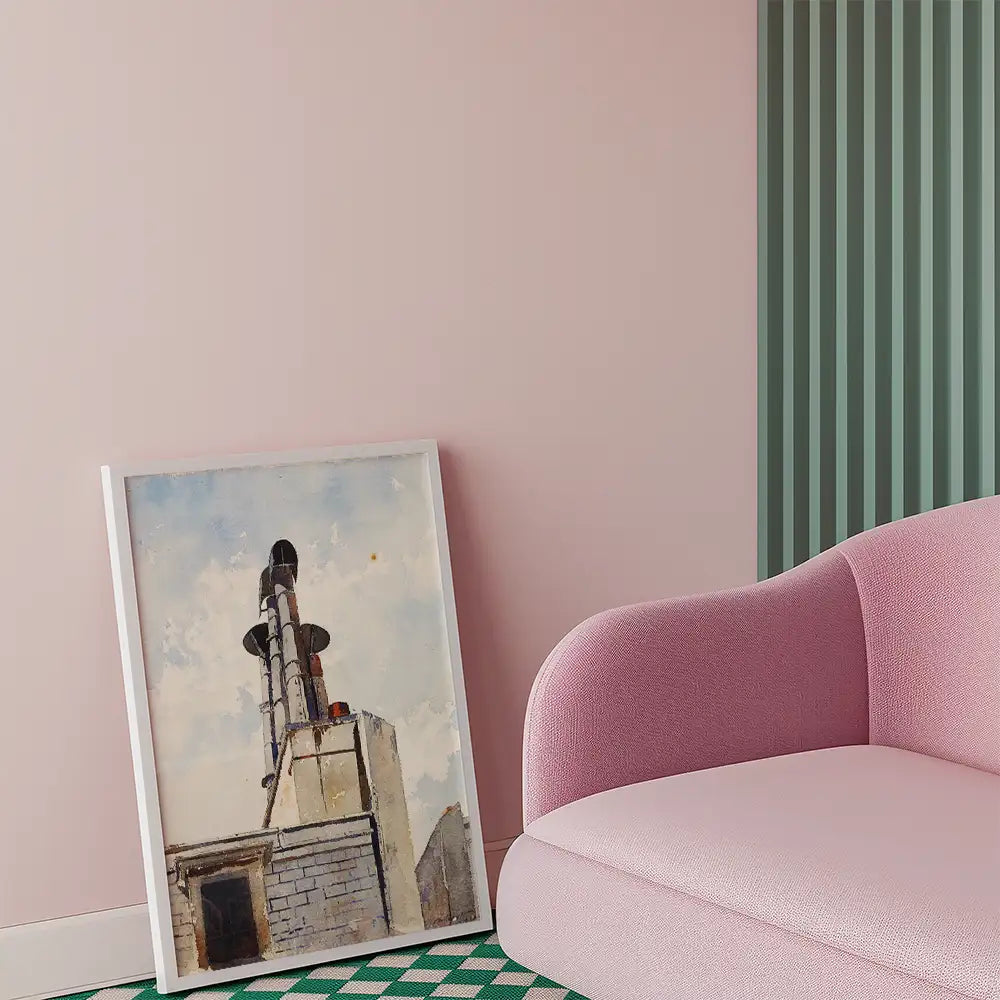 A framed painting of a building with chimneys leaning against a pink wall, next to a pink sofa.