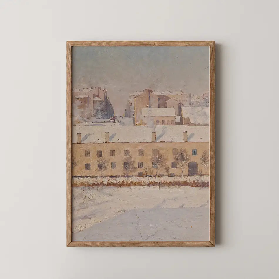 Framed painting of a winter landscape featuring buildings and snow, with muted colors and a serene atmosphere.
