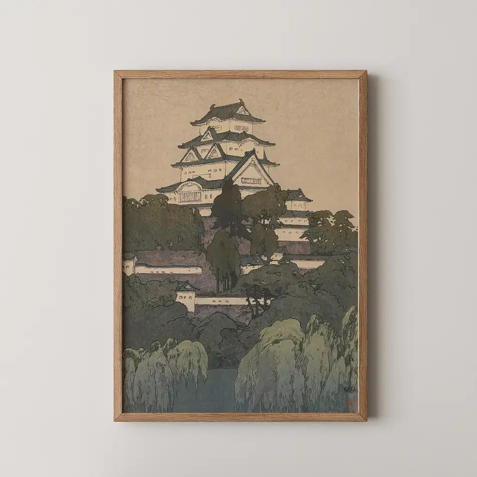 Framed painting of a traditional Japanese castle surrounded by trees on a textured background.