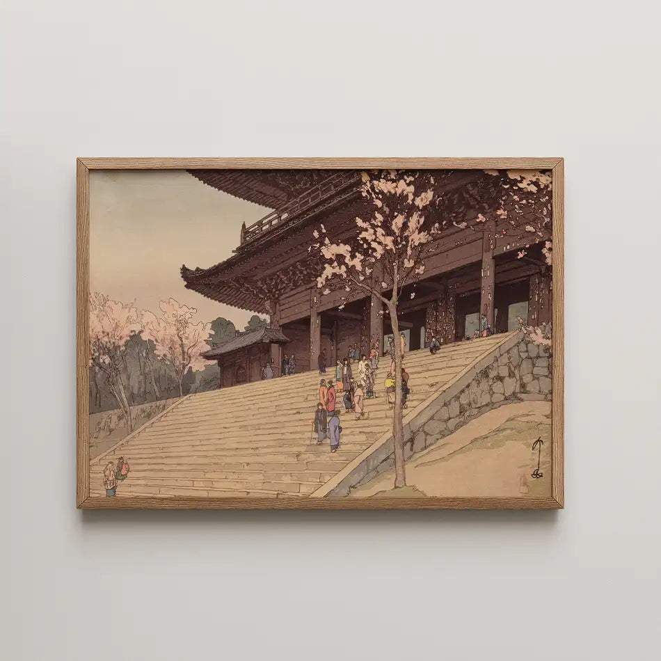 Framed painting depicting a traditional Japanese architecture scene with cherry blossom trees and people walking on stone steps.