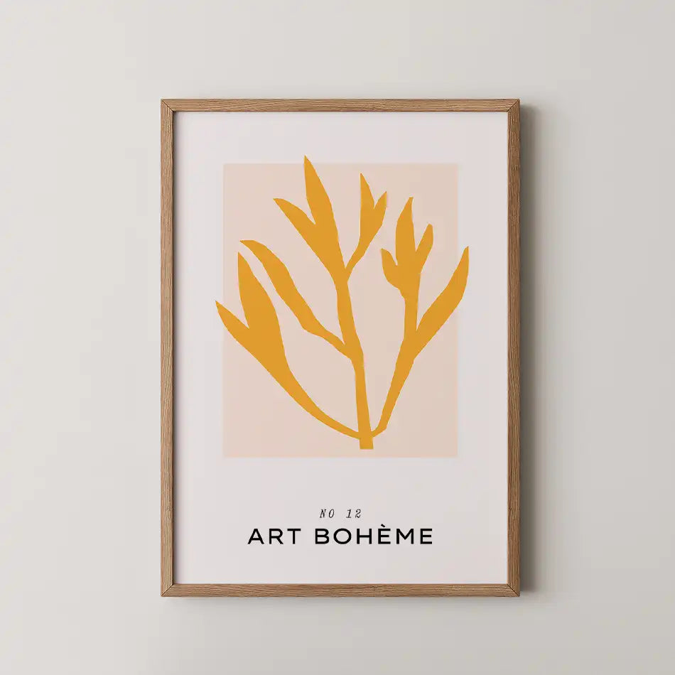 Modern art print featuring a bold golden sprig against a soft peach-hued background, framed in wood, ideal for minimalist home decor"