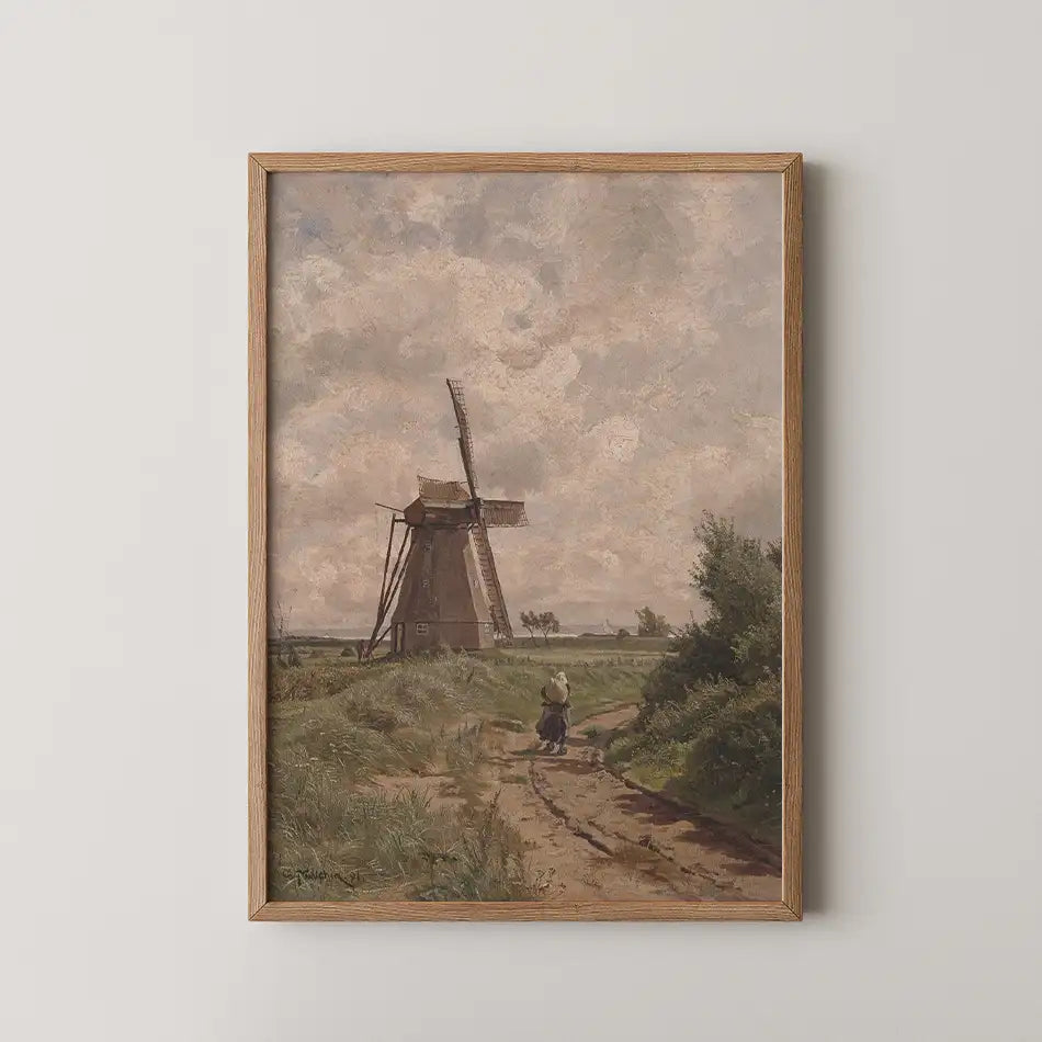 Painting of a landscape featuring a windmill, a pathway, and a person walking through greenery, framed in a wooden frame.