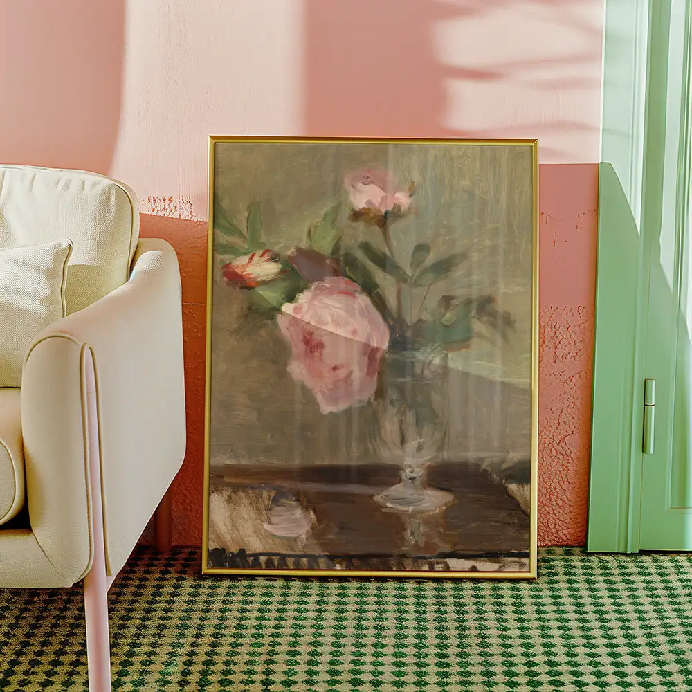 Painting of pink roses in a glass vase displayed in a stylish interior setting with a pastel color palette.