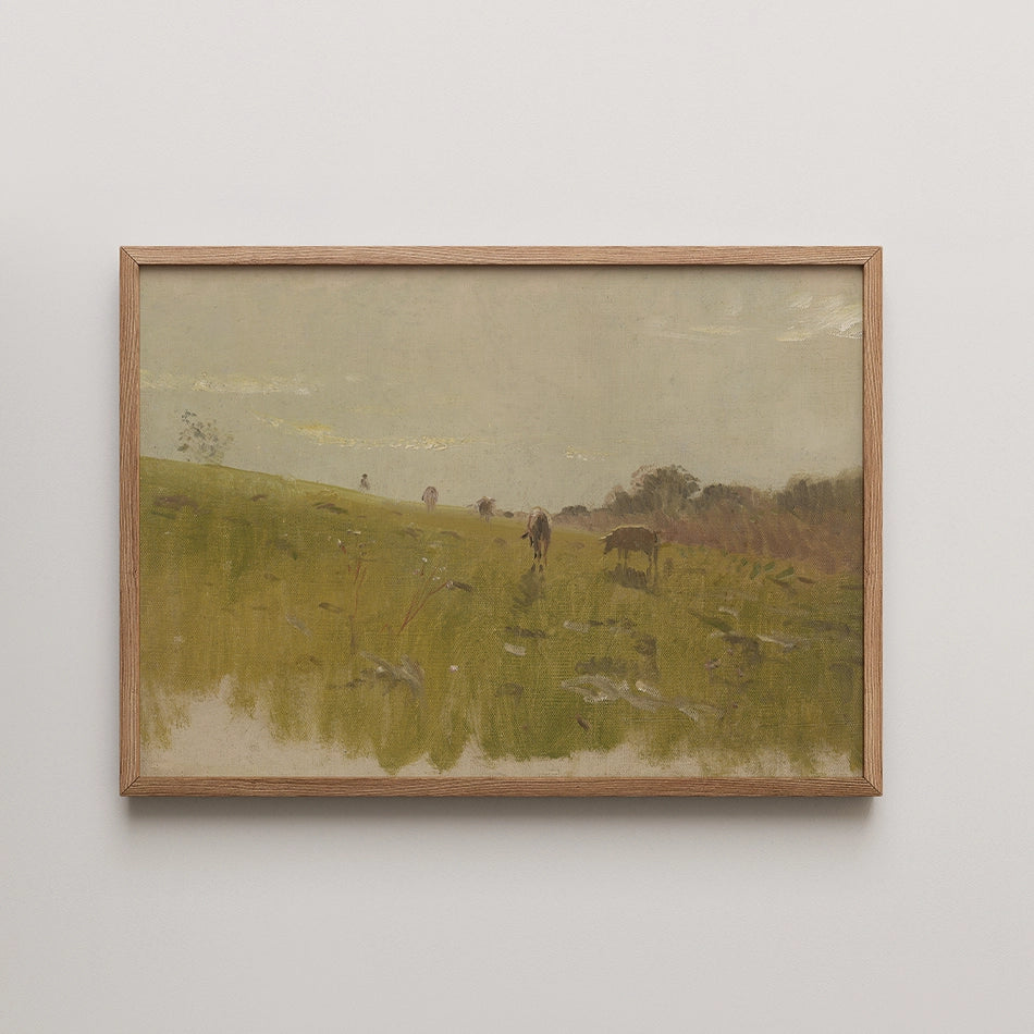 Framed painting of a serene landscape featuring cows grazing in a grassy field under a soft sky.