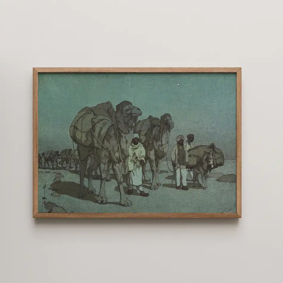 Framed painting of camel caravan with figures in traditional attire against a muted green background.