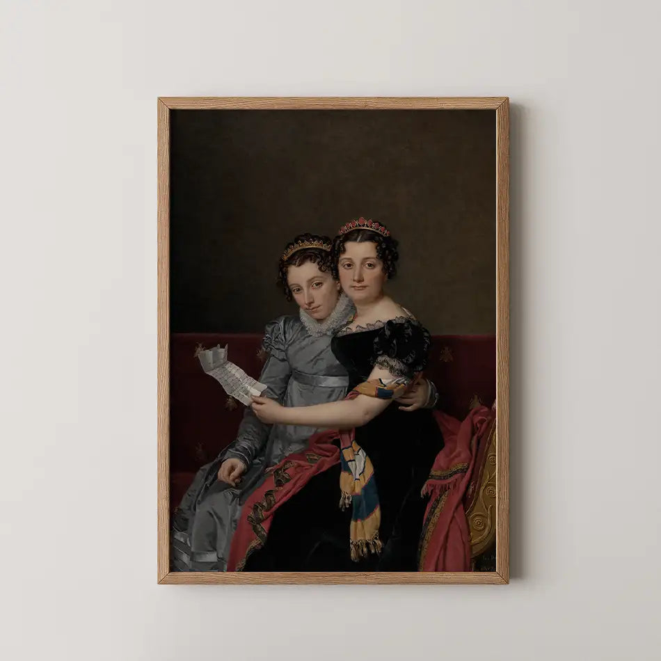 Portrait of two women in elegant attire seated together, holding a letter, framed in a wooden frame.