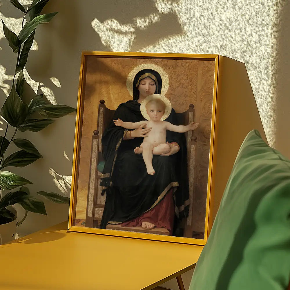 Framed painting of the Madonna and Child, featuring a seated Virgin Mary with a halo and a cherubic infant Jesus, displayed on a yellow table with green foliage in the background.