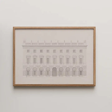 Framed painting of a historical building facade with arched windows and ornate detailing.
