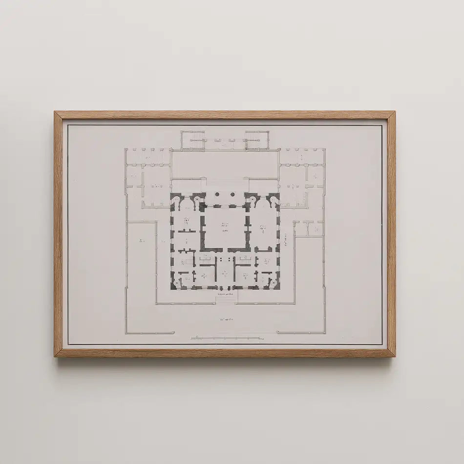 Framed architectural floor plan artwork on a white wall