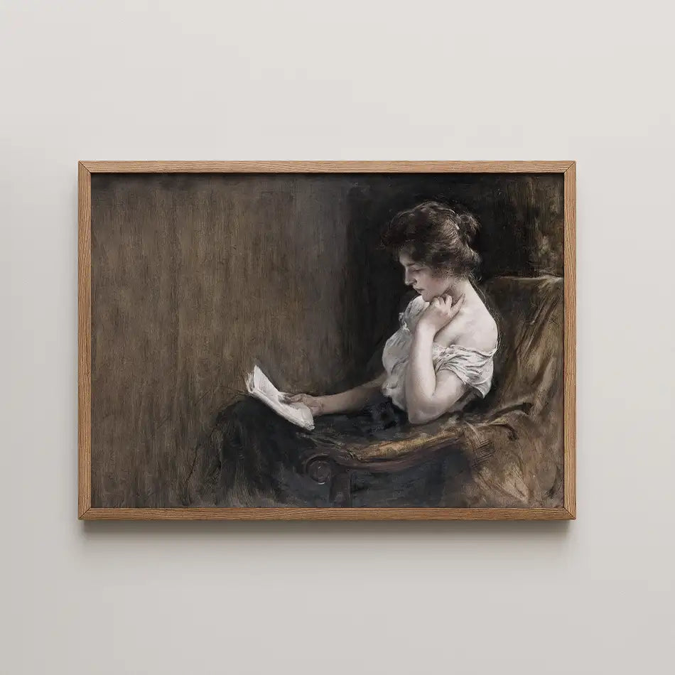Painting of a woman reading a book while seated in an armchair, framed in wood.