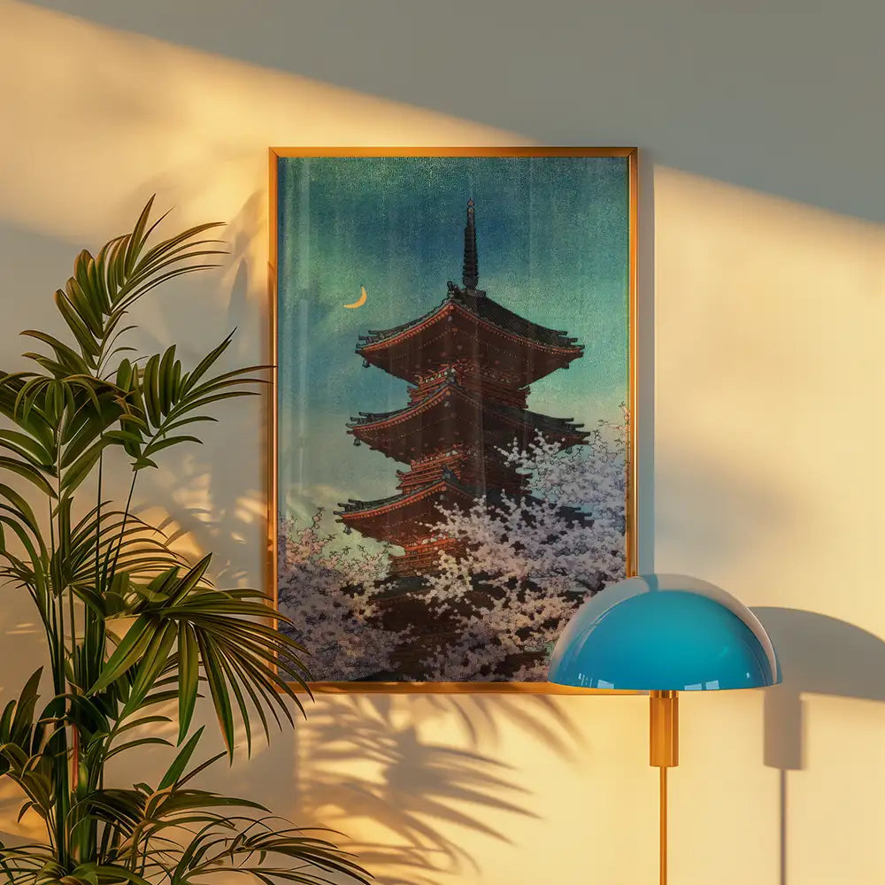 Digital art print of a traditional Japanese pagoda surrounded by cherry blossoms under a night sky with a crescent moon, framed in a wooden frame.