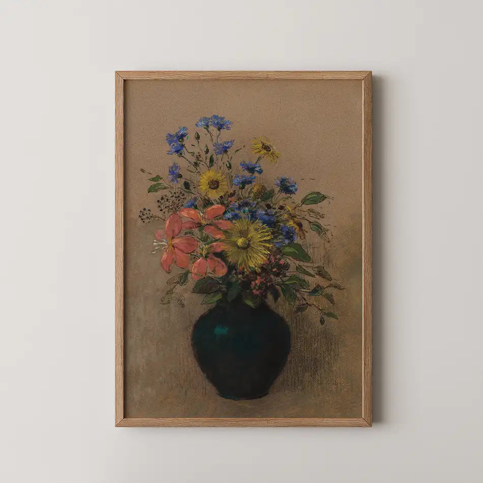 A vibrant painting of a bouquet of flowers in a dark vase, featuring yellow, blue, and pink blossoms, framed in wood against a neutral background.