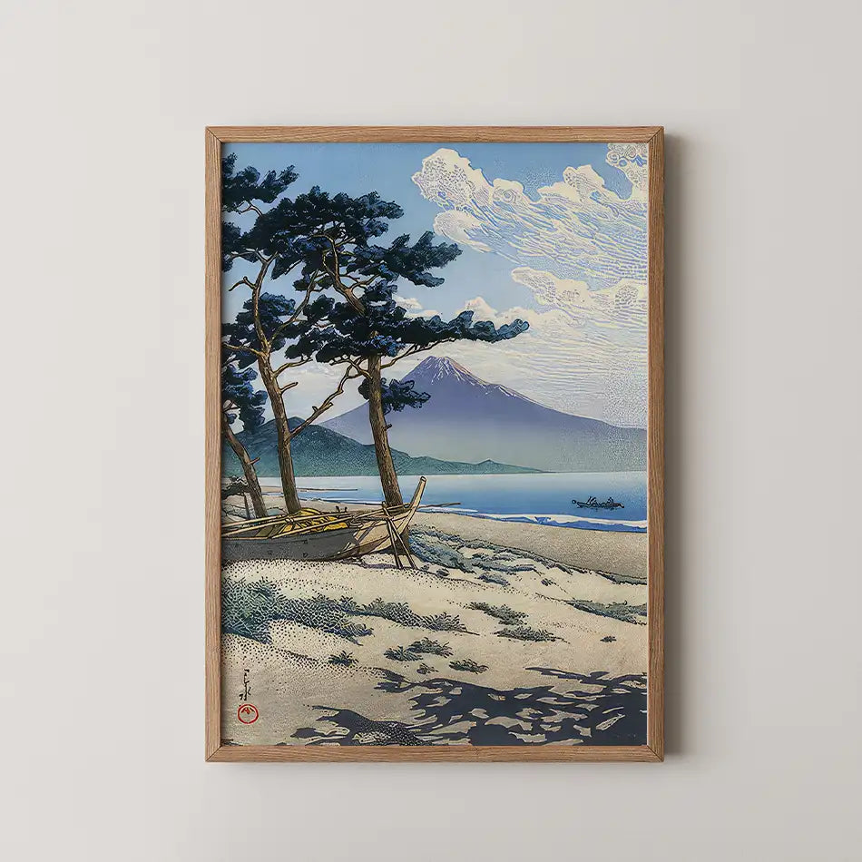 Framed painting of a serene landscape featuring pine trees, a calm sea, and a distant mountain under a partly cloudy sky.