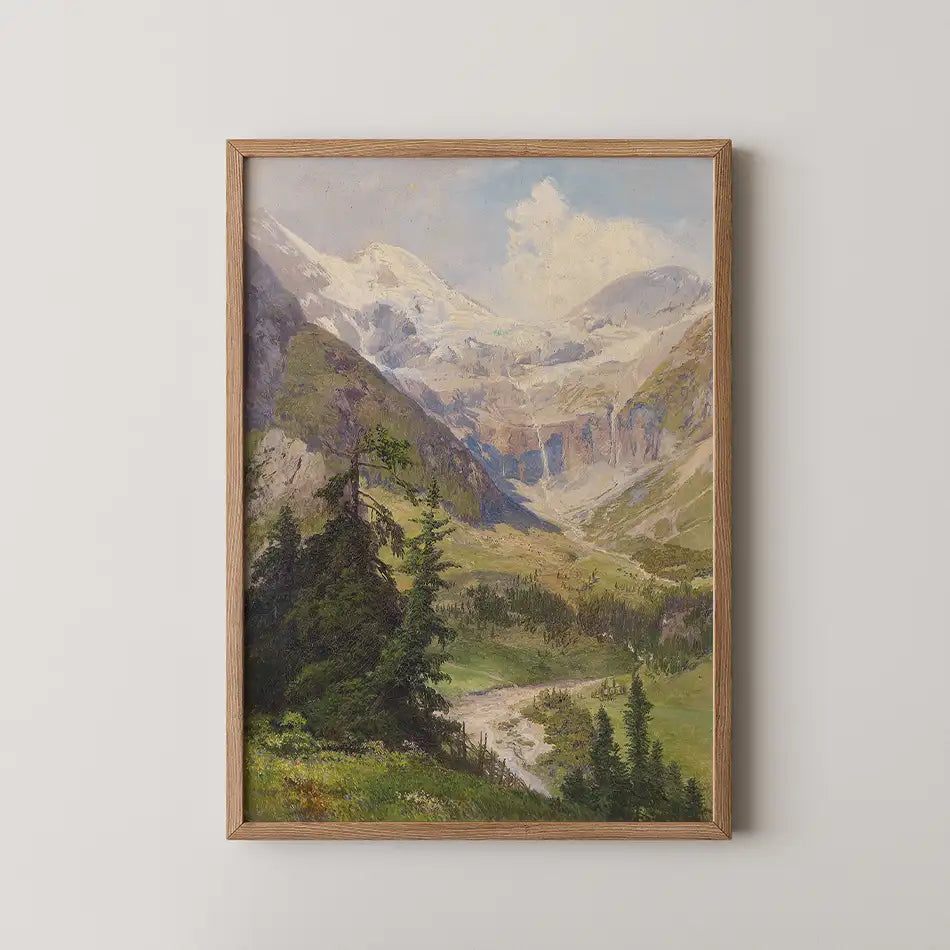 Framed painting of a scenic mountain landscape with trees and a winding river in a lush valley under a blue sky.