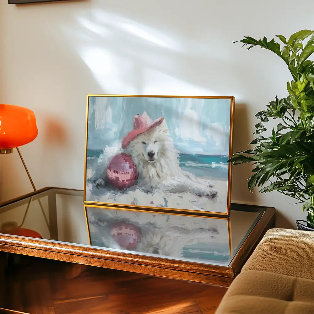 Modern poster featuring a fluffy white dog in a pink hat lounging on the beach with a reflective ball, framed beautifully for home decor.