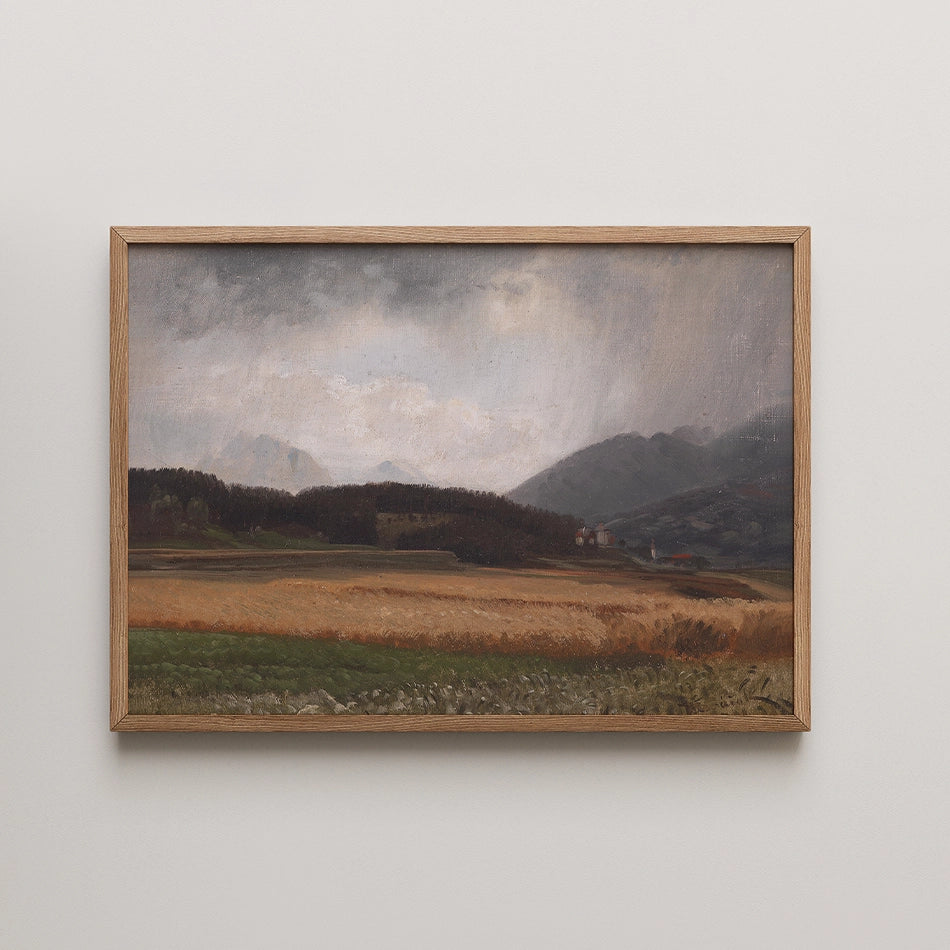 Landscape painting with mountains and fields in a wooden frame