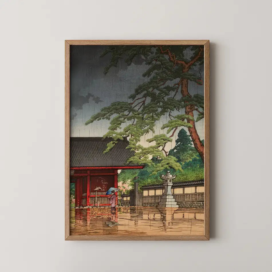 Framed painting of a serene Japanese landscape featuring a traditional building, trees, and a person with an umbrella in a flooded setting.