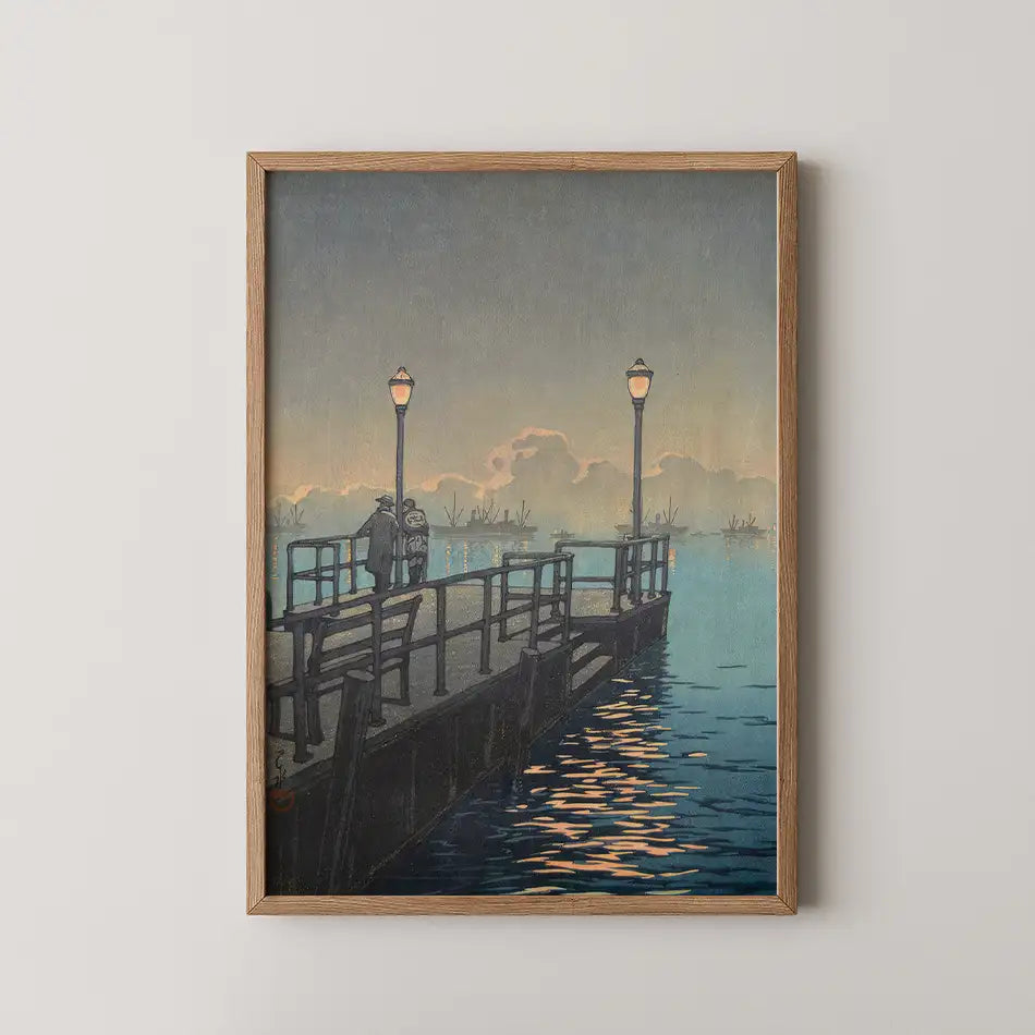 A framed painting depicting a twilight scene of a pier with dimly lit lampposts and a couple standing by the water.