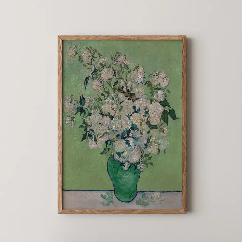 Painting of white flowers in a green vase on a light green background, framed in natural wood.