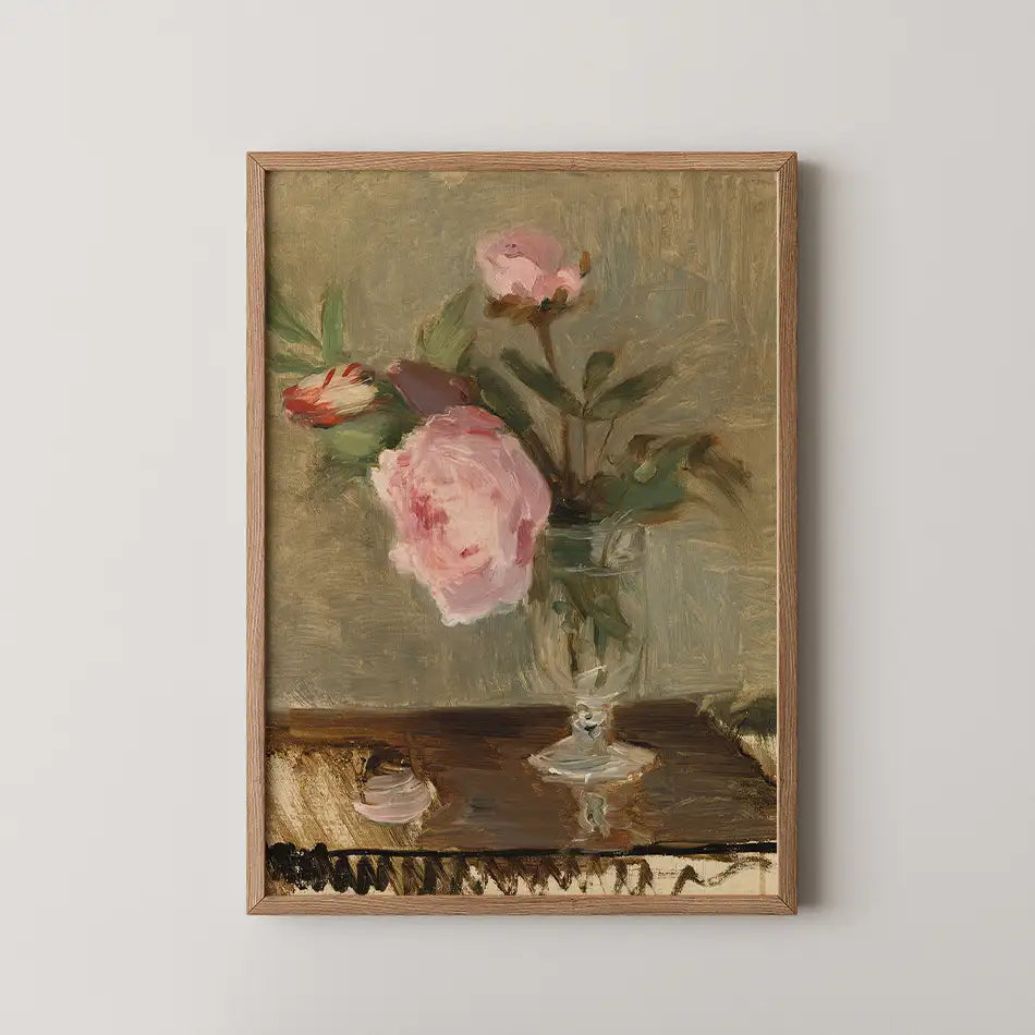 Painting of a vase with pink peonies on a wooden table against a soft, muted background, framed in natural wood.