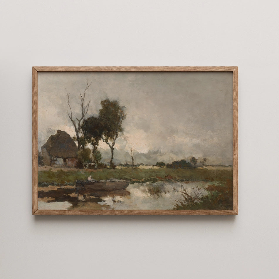 A serene landscape painting featuring a cottage by a calm water body, surrounded by trees under a cloudy sky, framed in natural wood.
