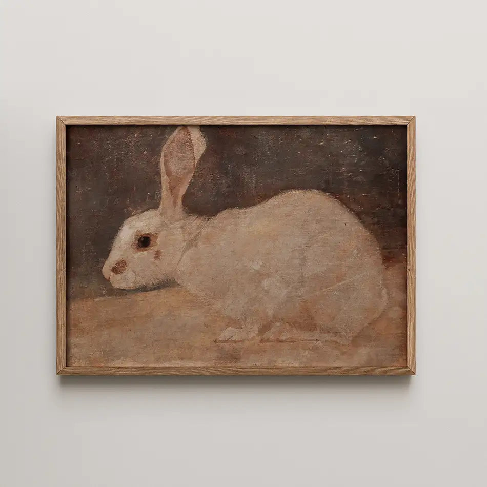 Painting of a white rabbit displayed in a wooden frame.