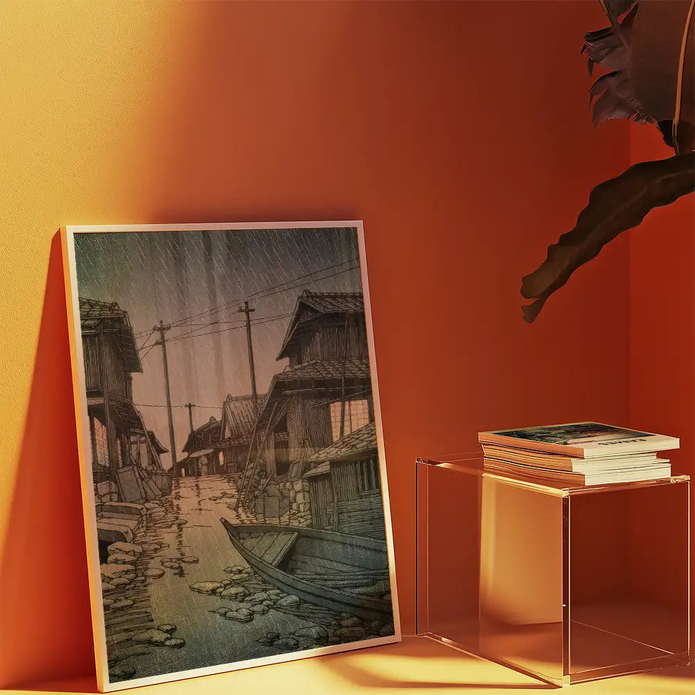 Painting of a rainy street lined with traditional houses and a small boat, displayed against an orange wall.