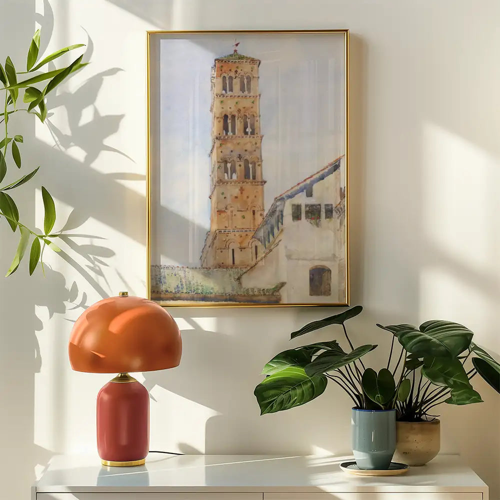 A beautifully framed painting of a tower set against a light background, displayed on a wall next to a modern lamp and potted plants, showcasing a stylish interior decor arrangement.