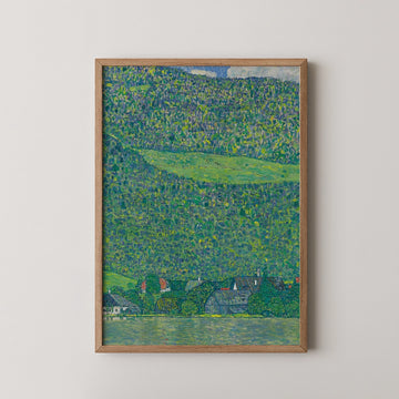 Framed painting of a lush green landscape with a river and houses in the foreground