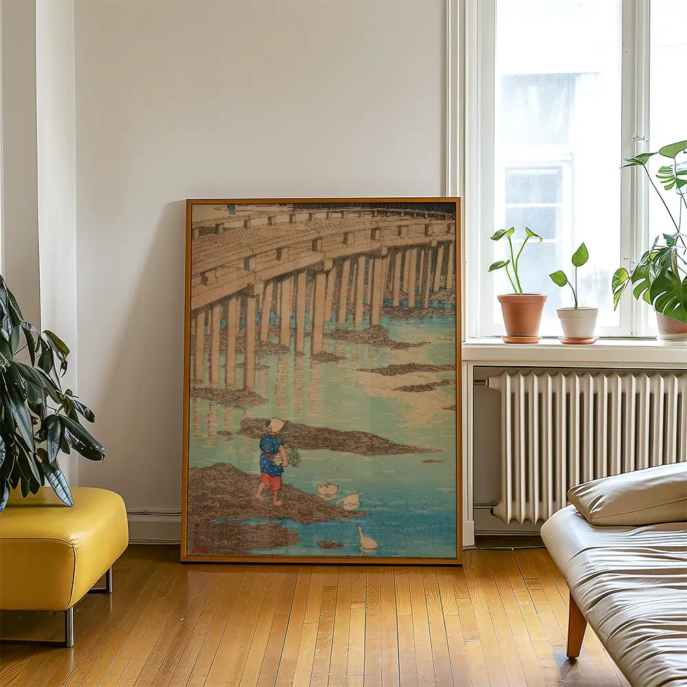 Painting of a child fishing near a wooden pier, displayed in a bright room with plants and modern furniture.