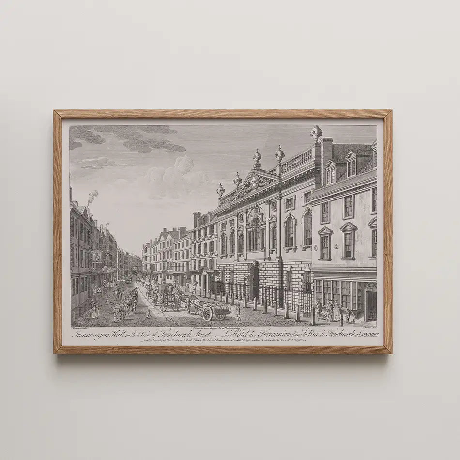 Framed black and white vintage engraving of a street scene featuring historical architecture and horse-drawn carriages.