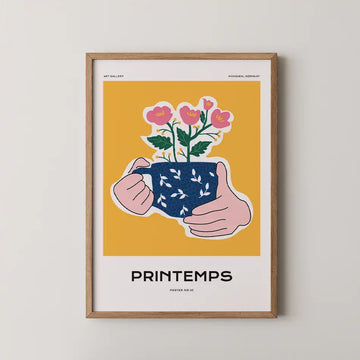 A Cup of Spring modern art print featuring cheerful pink blossoms in a deep blue mug against a vibrant mustard yellow background, perfect for brightening any space.