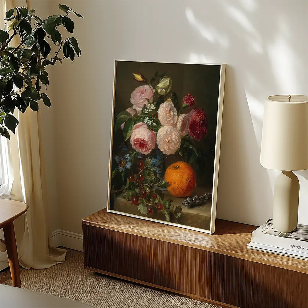 Still life painting of flowers and an orange displayed in a modern living space.