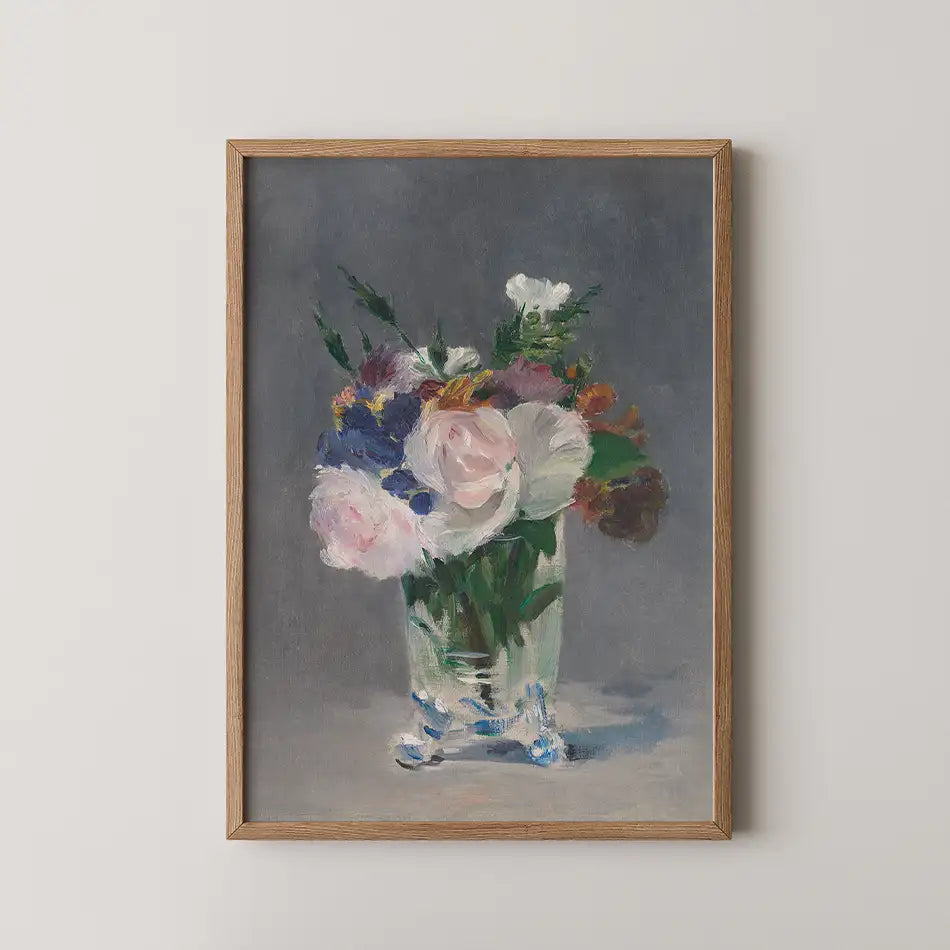Framed painting of a vase filled with colorful flowers on a gray background.