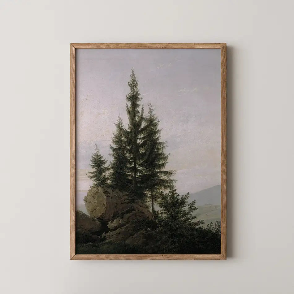 Framed painting of coniferous trees on a rocky landscape with a soft pastel sky in the background.