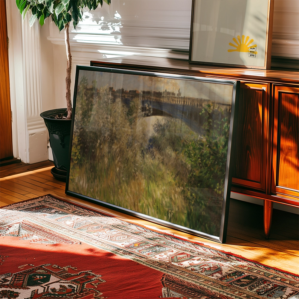 Framed painting of a serene landscape scene with a bridge, leaning against a wooden cabinet in a sunlit room with a plant and a decorative rug.