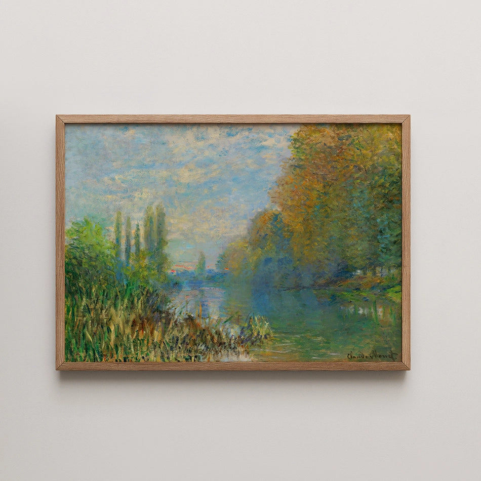 Framed impressionist painting of a serene river landscape with greenery and autumn trees.