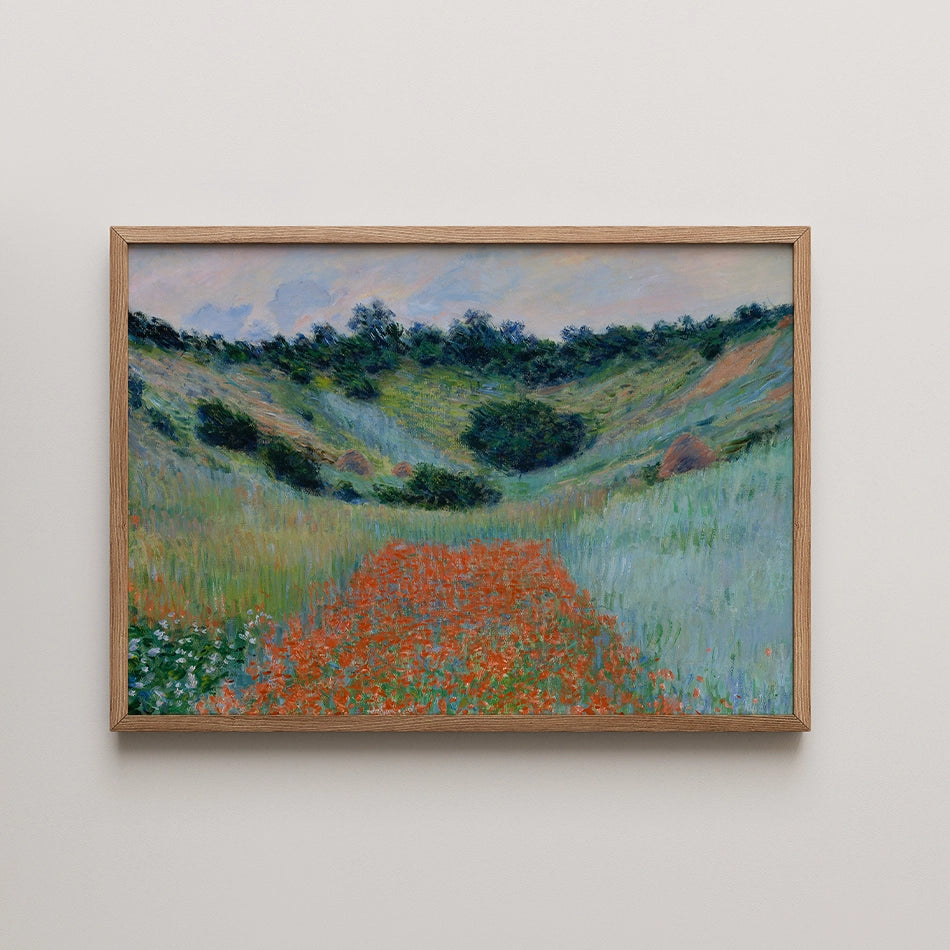 Framed painting of a lush green landscape with a vibrant orange path and trees in the background