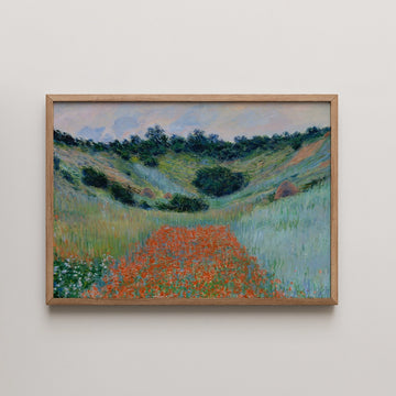 Framed painting of a lush green landscape with a vibrant orange path and trees in the background