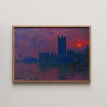 Framed painting of a sunset over a silhouetted cityscape with deep purple and red hues.