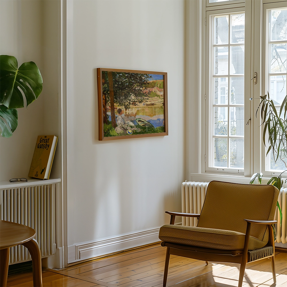 Painting framed and hung on a wall in a cozy room with a chair, a plant, and a book titled "The Great Gatsby."