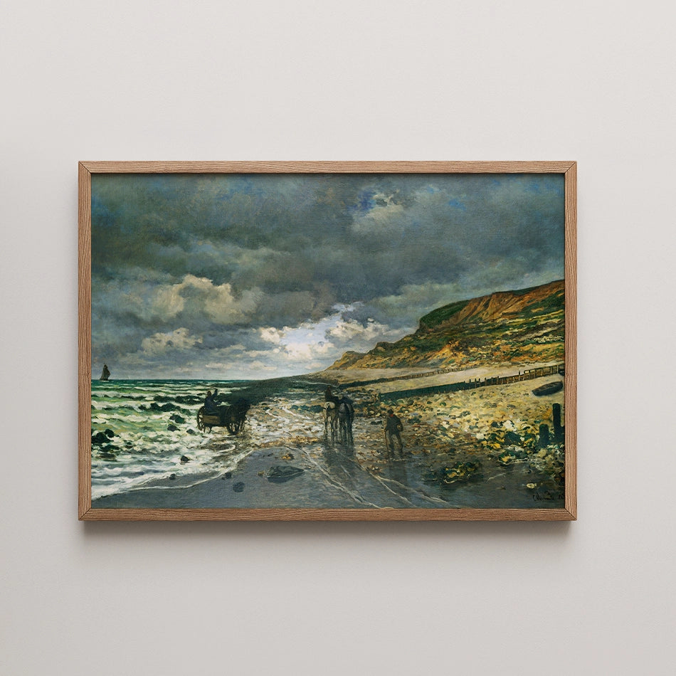 Painting of a coastal scene with dark clouds, waves, and figures on the beach in a wooden frame.