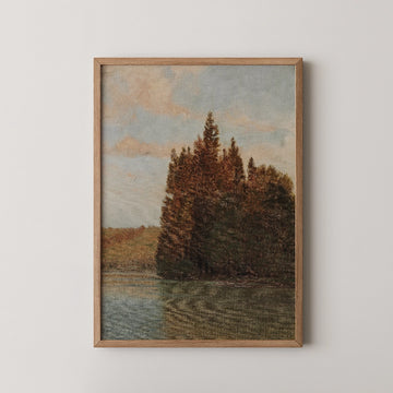 Framed painting of a serene landscape featuring trees and a calm water surface, with a blue sky in the background.