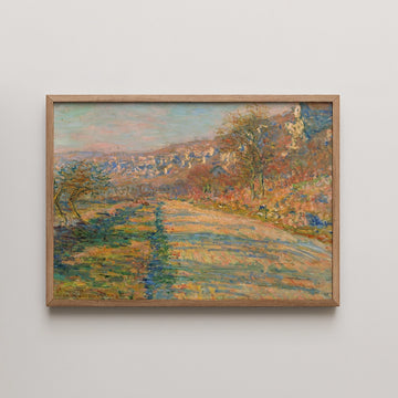 A vibrant landscape painting featuring a winding path through colorful trees, framed in natural wood.