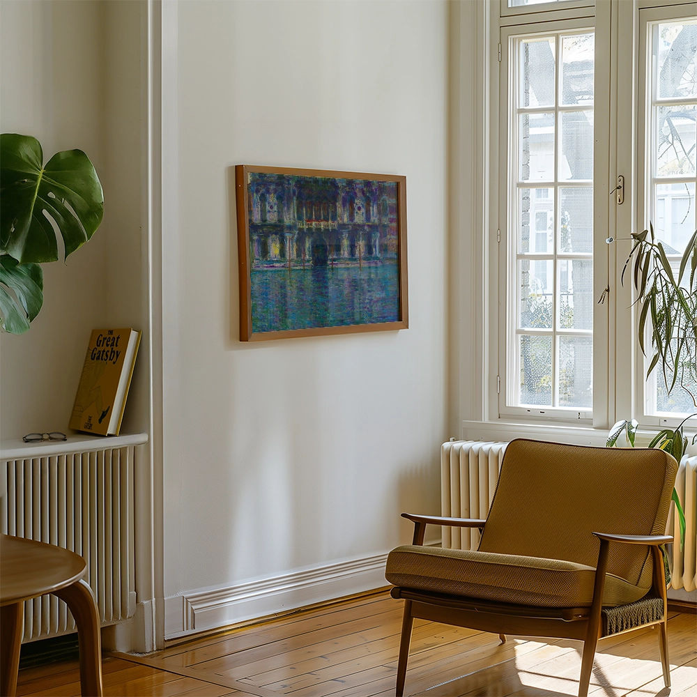 Painting framed and displayed on a wall in a bright, modern living room with a brown chair, a leafy plant, and a book on a shelf.