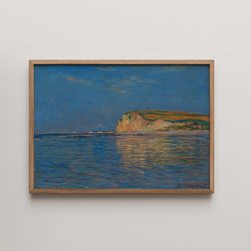 Painting of a coastal landscape with a blue sky and reflective water, framed in natural wood.