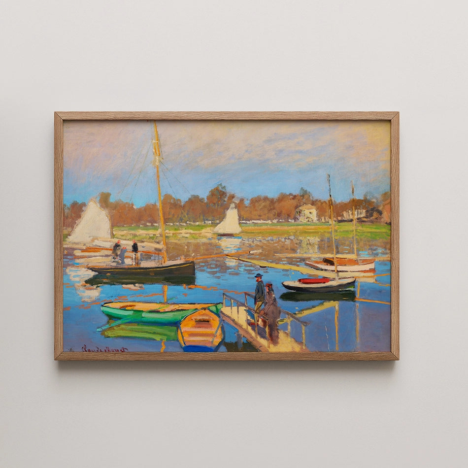 A vibrant painting of sailboats and a dock scene with figures, framed in light wood, featuring blue skies and reflections on water.