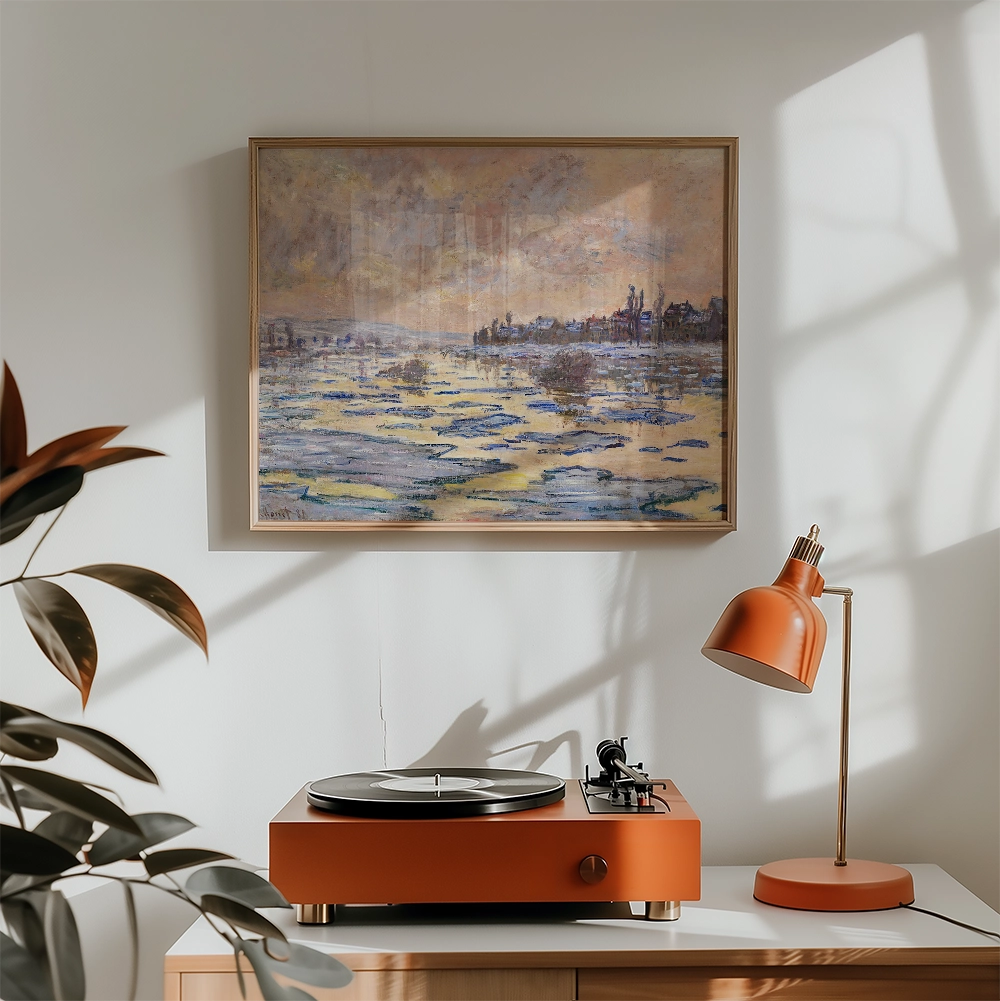 A framed painting of a calm landscape with water and buildings in soft pastel colors, displayed above a modern orange record player and lamp in a bright, airy room.