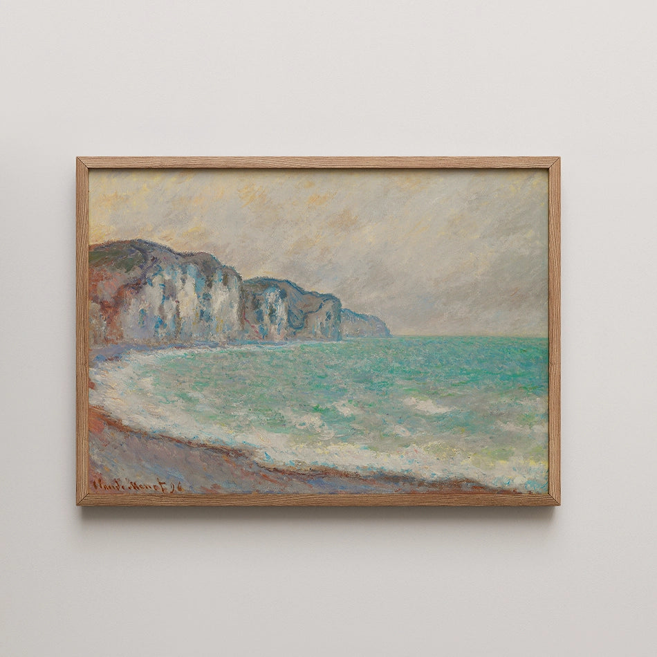 Framed painting of a serene seascape featuring rocky cliffs and gentle waves under a cloudy sky.